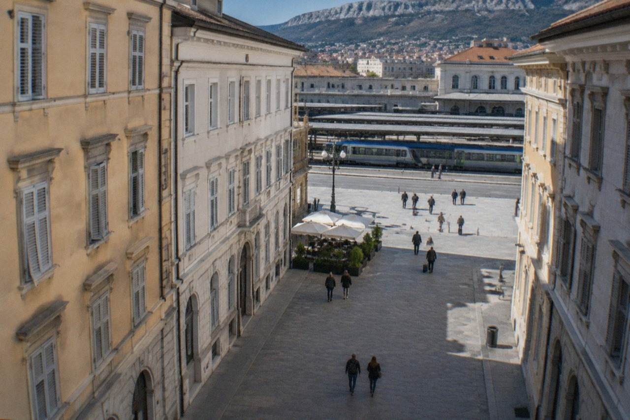 A regional train waiting at Trieste Centrale station in Italy