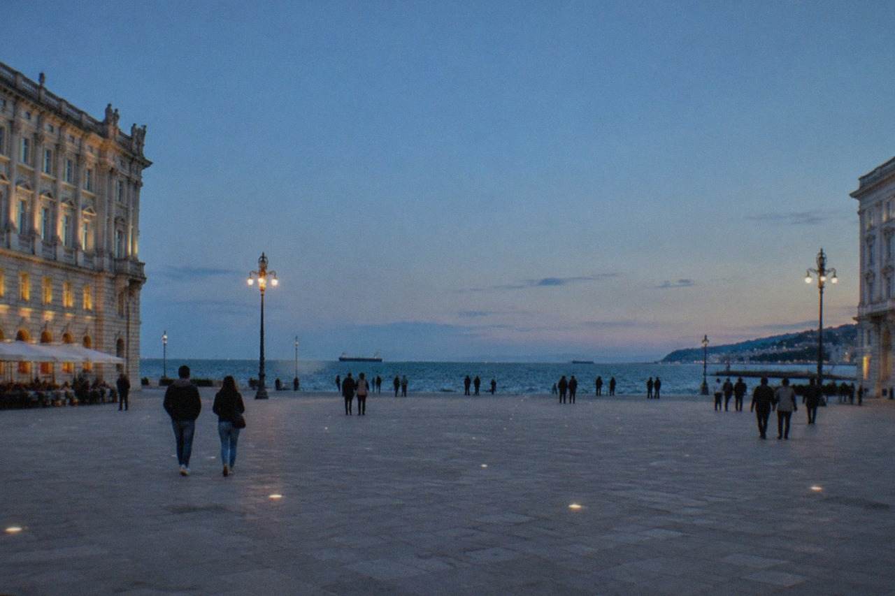 The seafront of Trieste, Italy, with the historic buildings of Piazza Unità d'Italia facing the Adriatic on a clear day