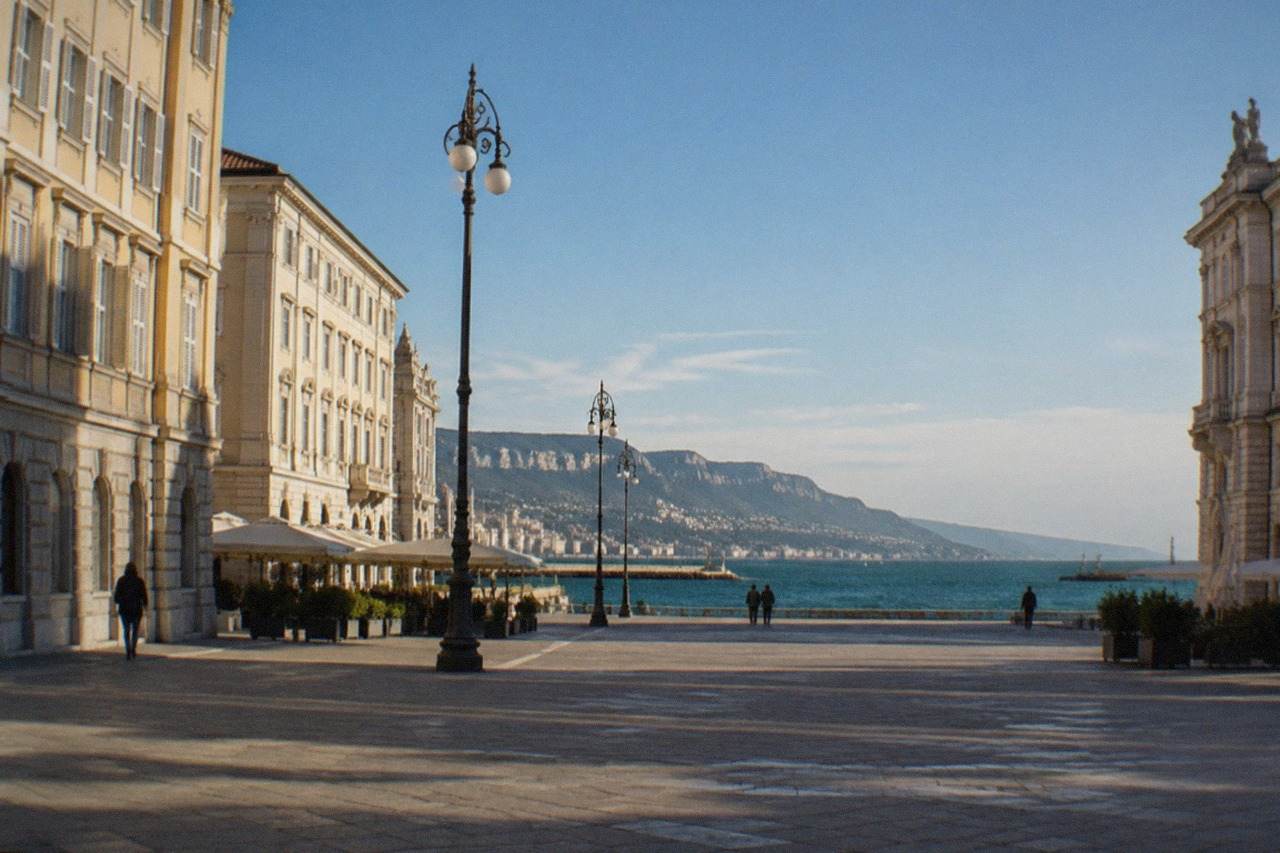 The seafront square of Trieste, Italy, with historic facades and the Adriatic horizon beyond
