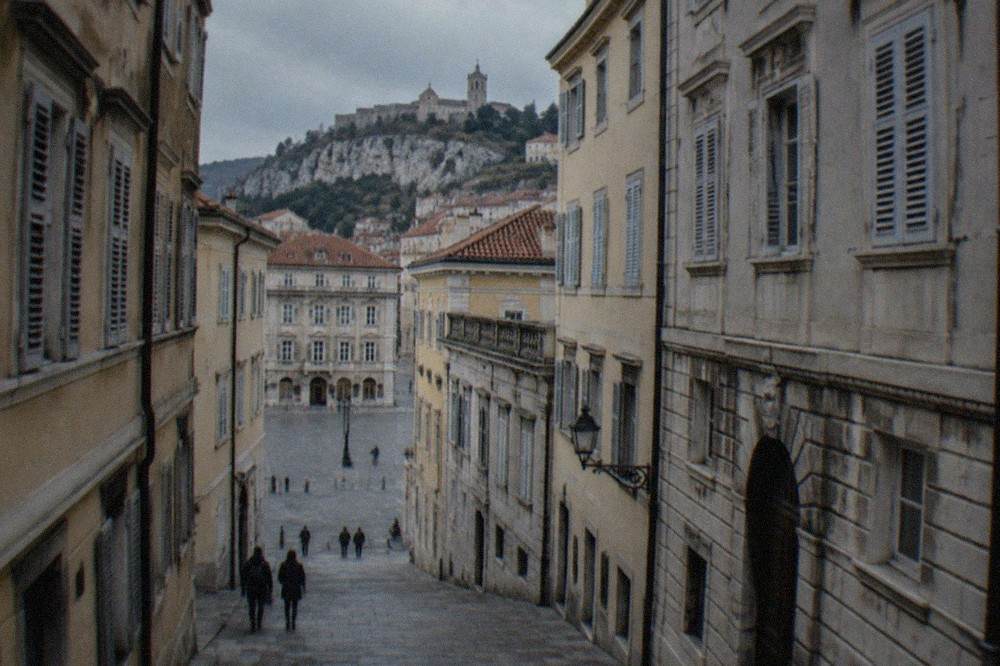 A narrow lane of the old town rising towards the cathedral and castle hill