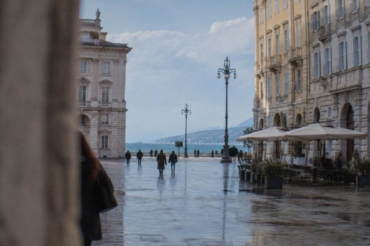 The seafront square of Trieste, Italy, with the Adriatic stretching to the horizon behind the grand facades of Piazza Unità d'Italia
