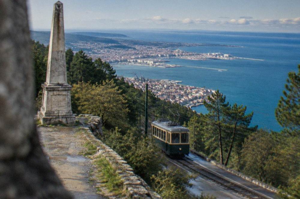 The Opicina tram climbing the steep Karst slope above Trieste with the Gulf of Trieste below