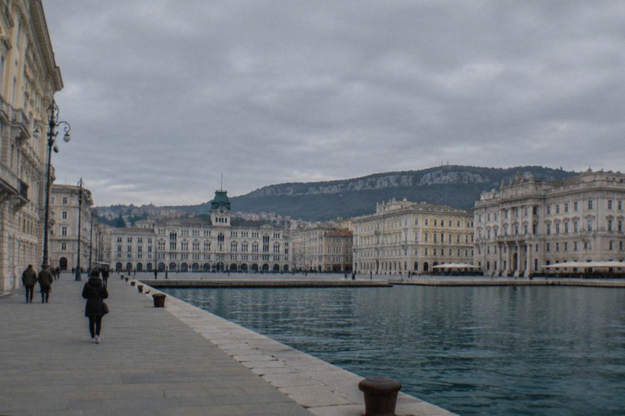 The seafront square of Trieste with grand Habsburg-era facades and the Adriatic behind them