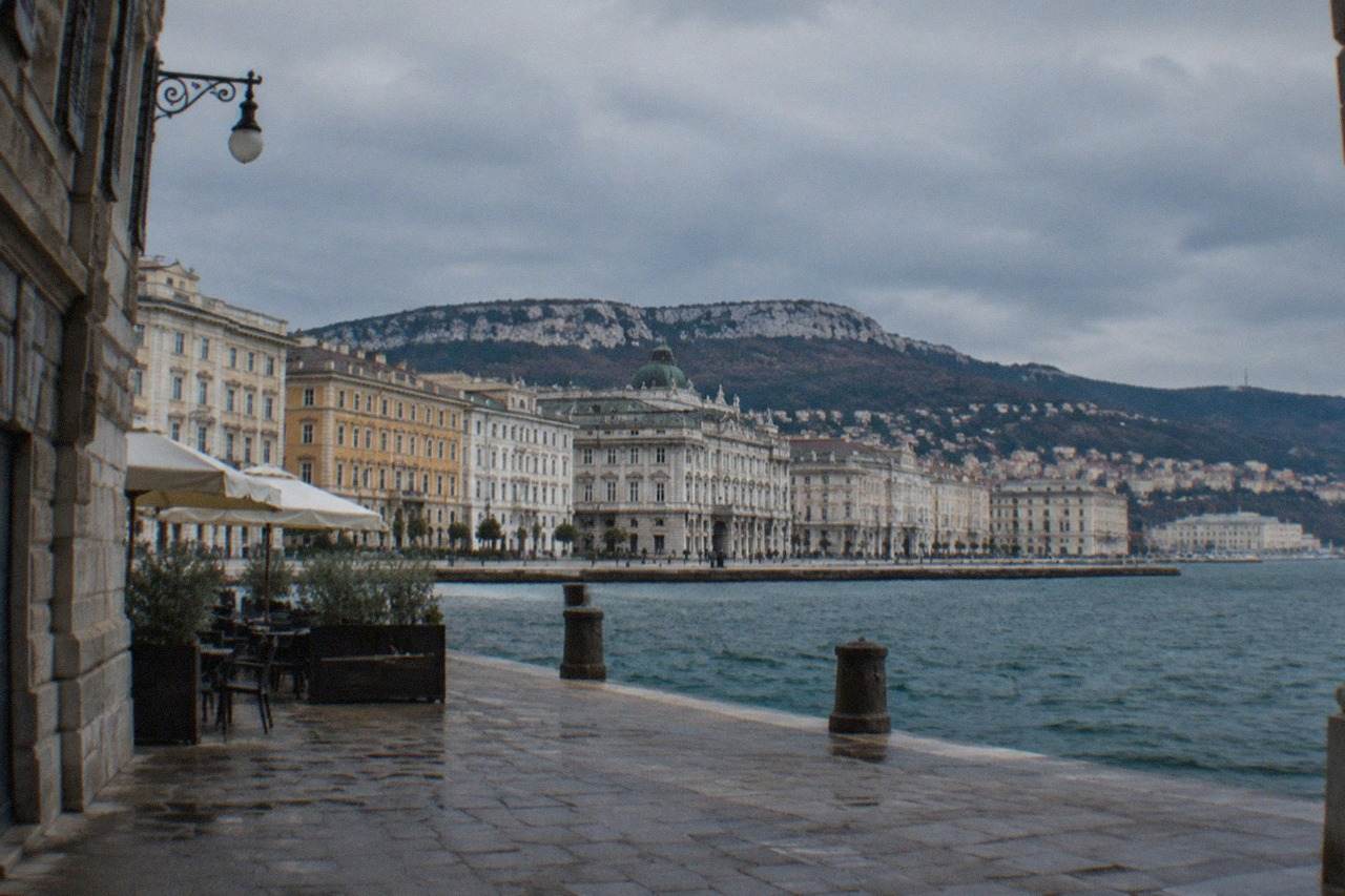 The seafront of Trieste, Italy, with the historic waterfront buildings and the Adriatic gulf behind them