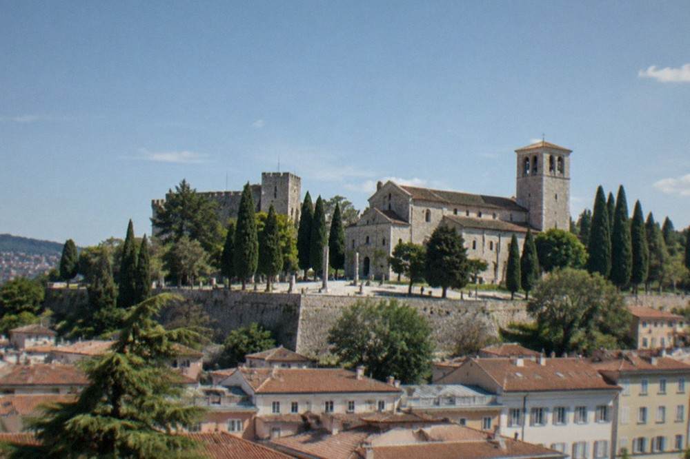 The hill of San Giusto in Trieste with the castle and cathedral above the city rooftops