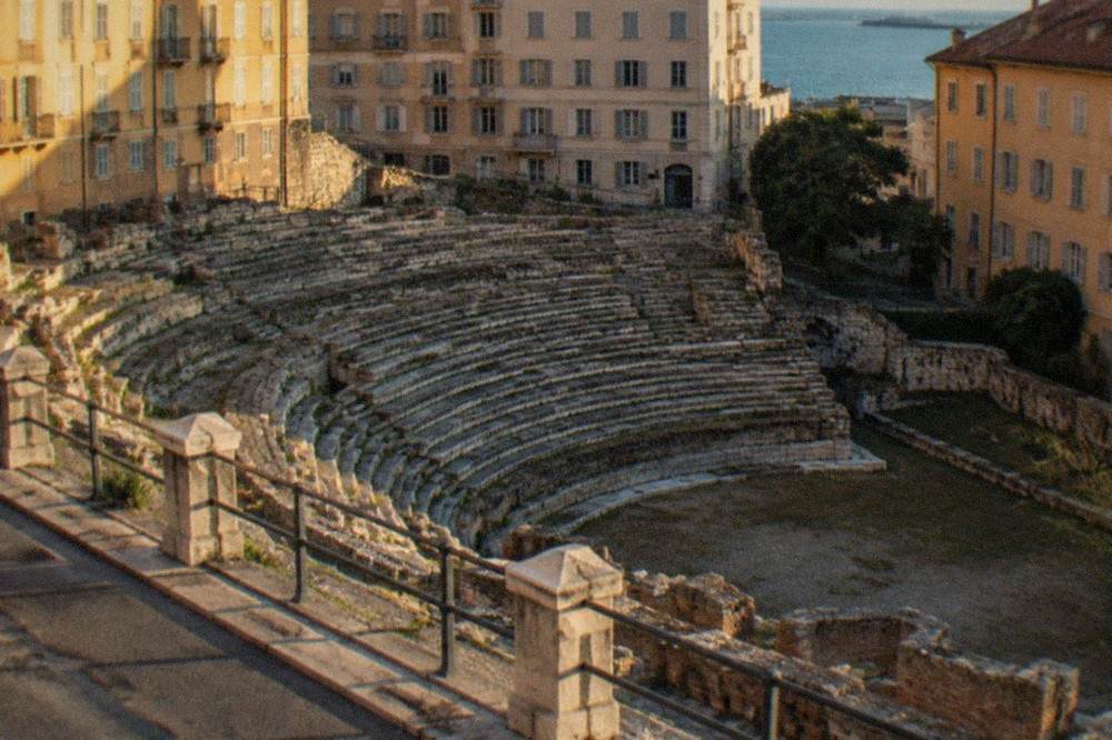The Roman theatre of Trieste seen from the road above, with stone seating tiers