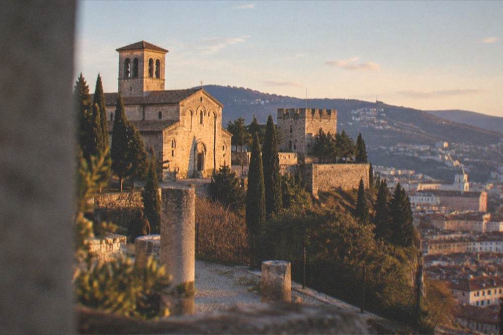Wide view of Trieste's old town hillside with the castle and cathedral above the city