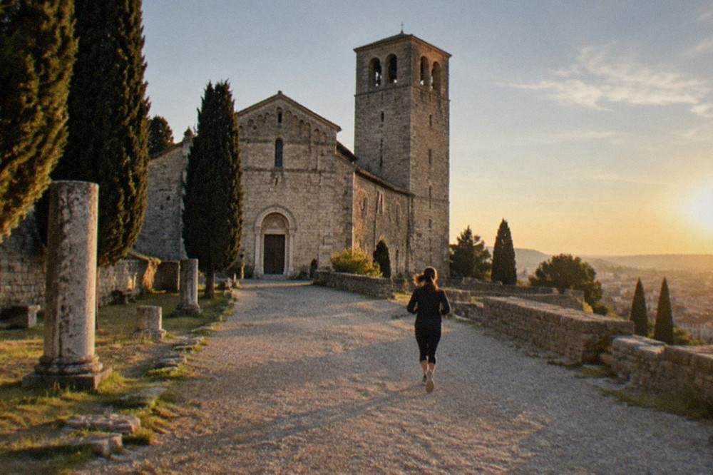 The facade and Romanesque bell tower of Trieste Cathedral on the summit of the San Giusto hill