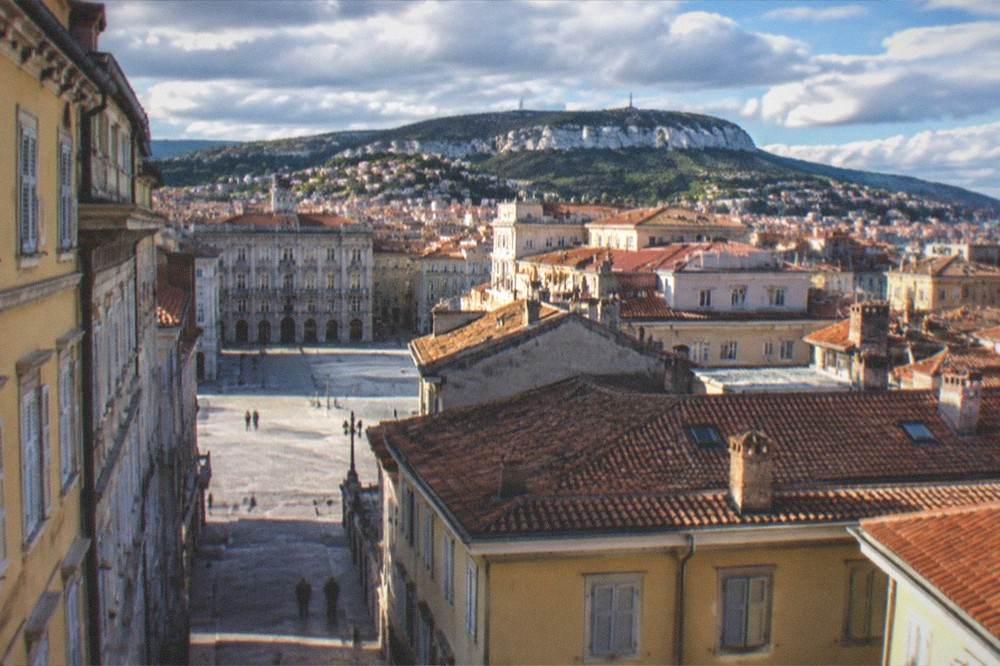 The tiled roofs of the old city of Trieste seen from above near the castle hill