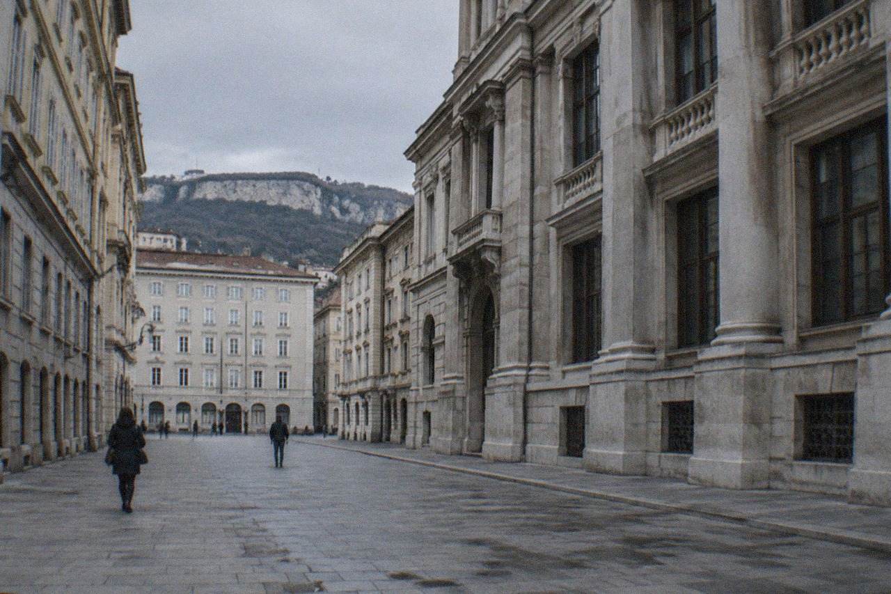A historic museum building facade in Trieste with stone columns and tall windows