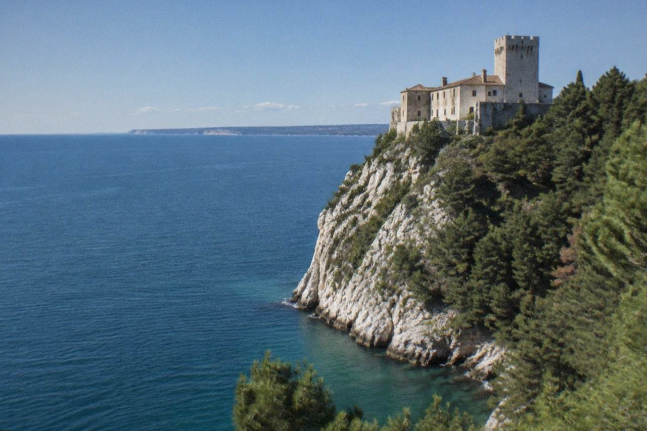 Duino Castle on its cliff above the blue Adriatic near Trieste
