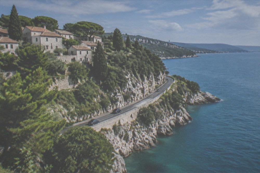 The coastal road between Duino and Trieste seen from above the sea