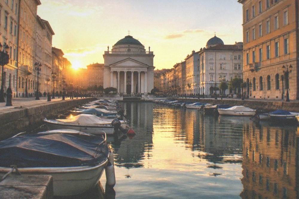 Evening light on the Canal Grande with the church facade lit and reflections in the water
