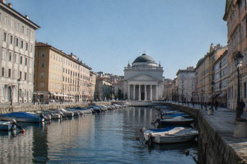 The Grand Canal of Trieste with the Sant'Antonio church at its head seen from a nearby street