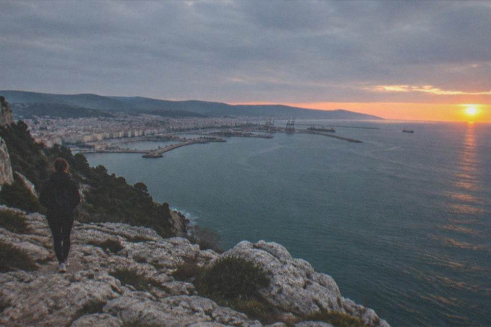The Gulf of Trieste at sunset seen from a limestone cliff top