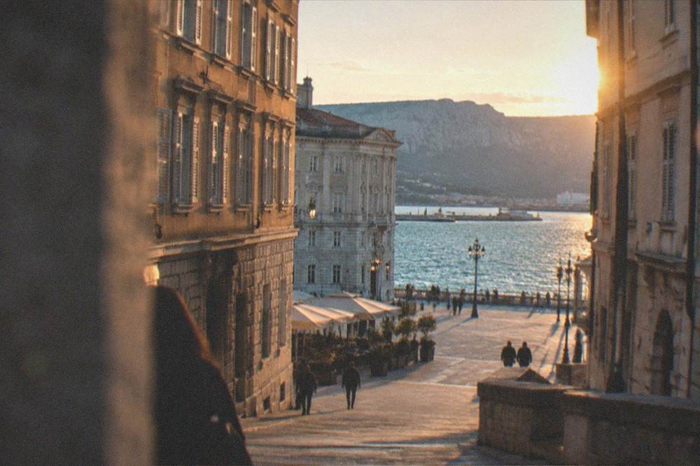 Evening light over the rooftops and gulf of Trieste seen from the city