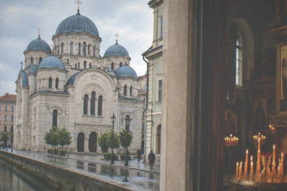 Candles and painted icons inside an Orthodox church interior in Trieste
