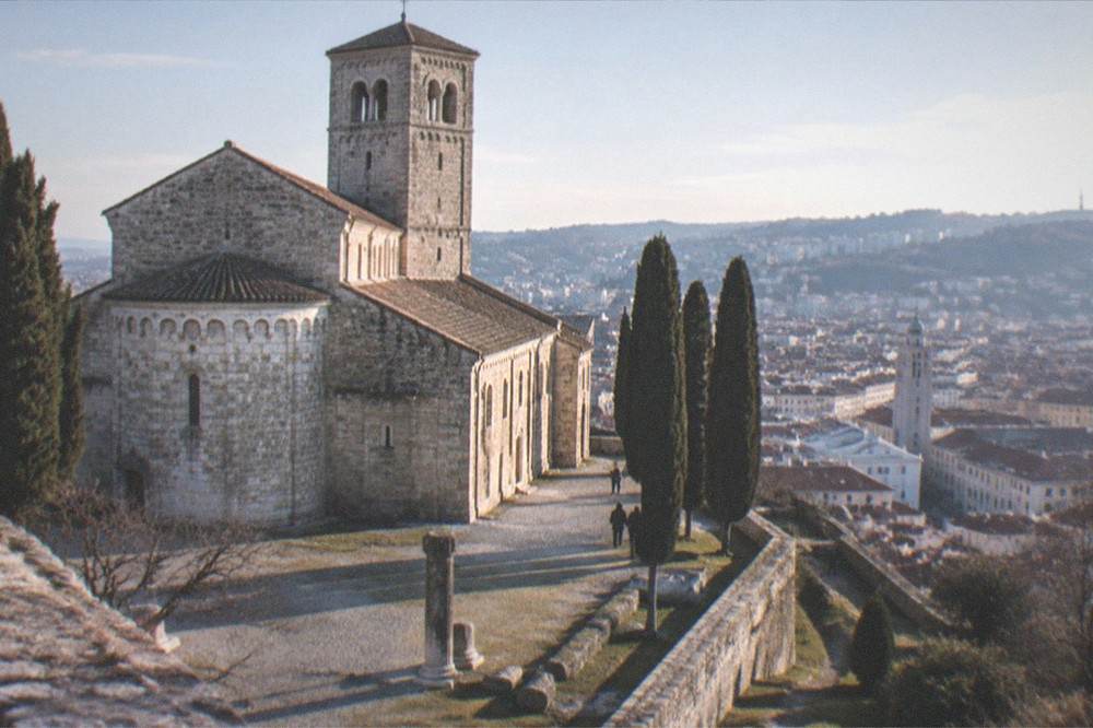 The cathedral bell tower rising above the rooftops of the Trieste old town