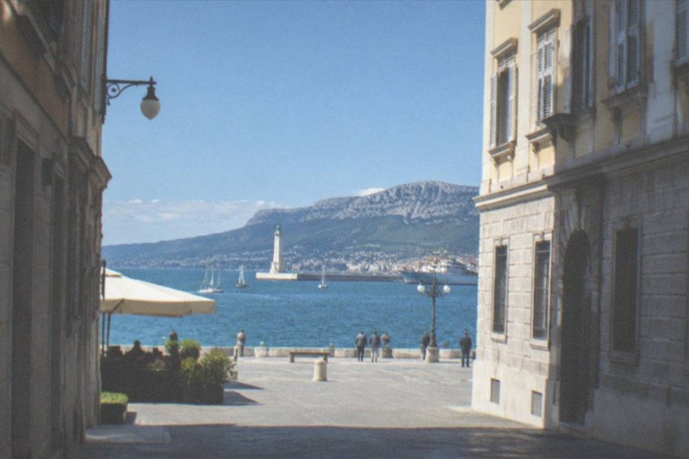 The Trieste waterfront with the lighthouse and the gulf on a clear day