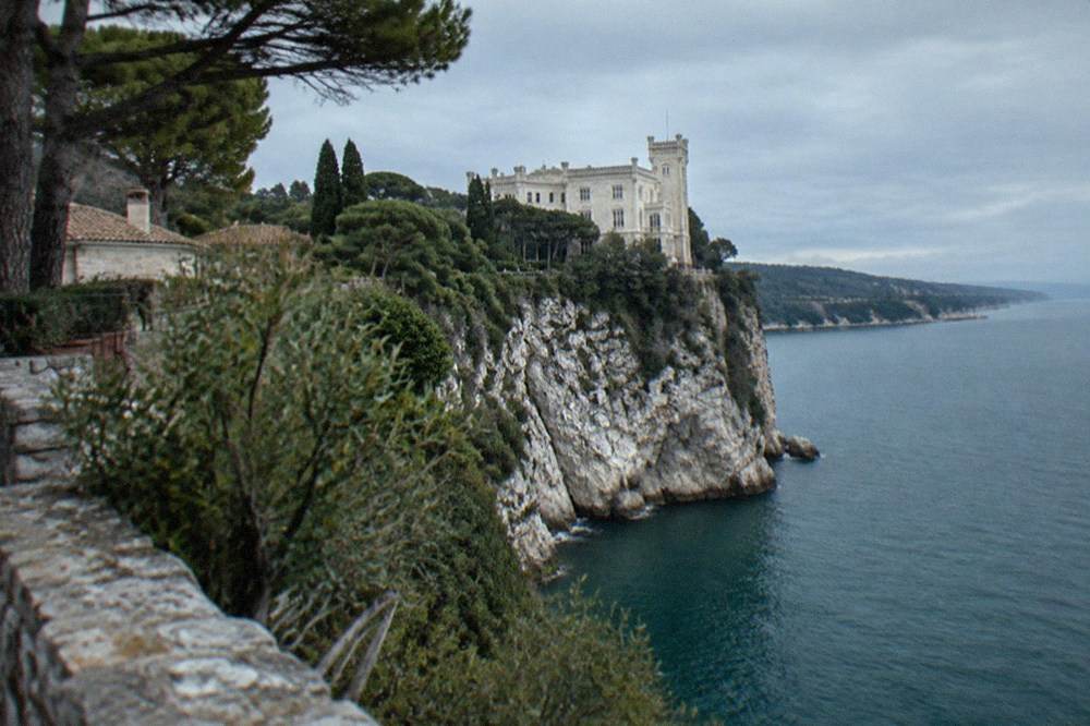 A white castle on a cliff above the Adriatic sea near Duino