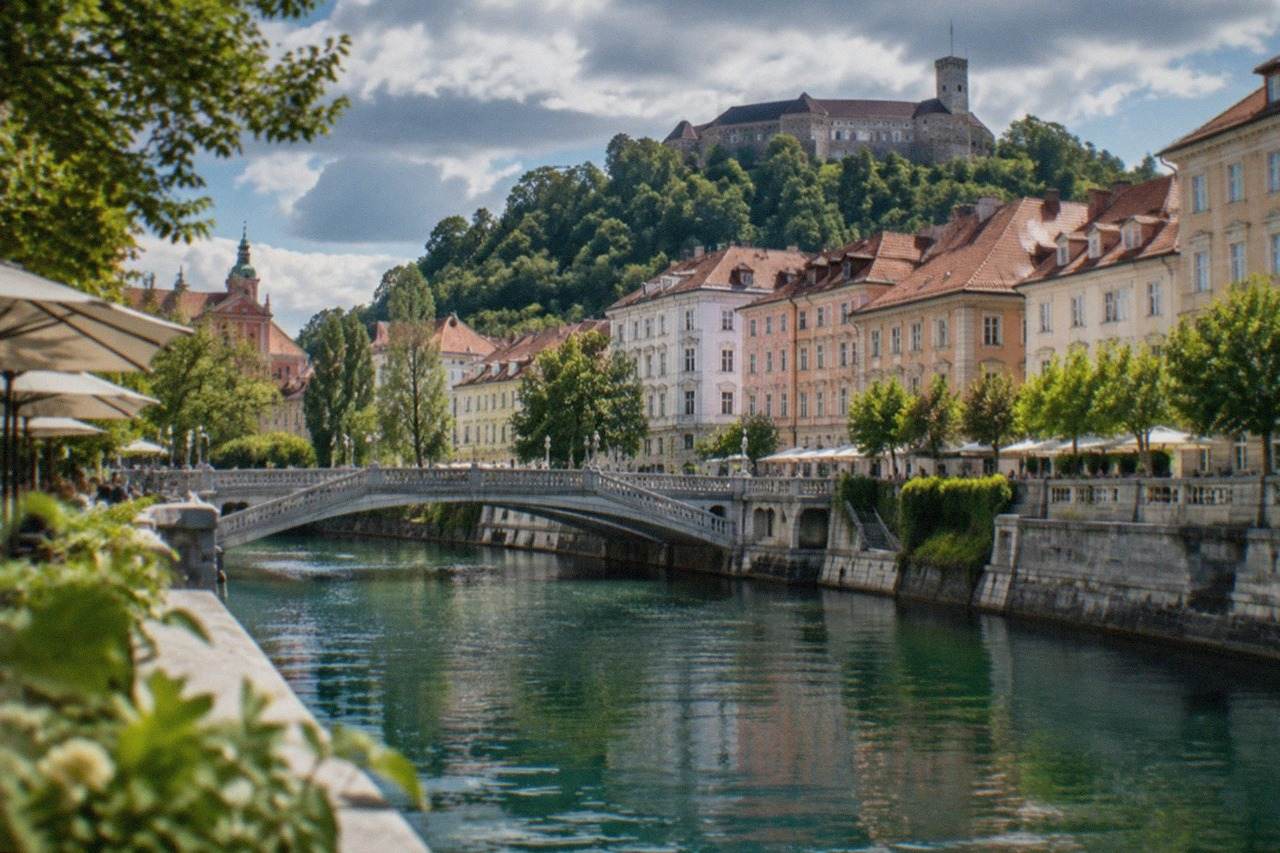 The Ljubljana riverside with its terraced bridge and the castle on the hill above the city