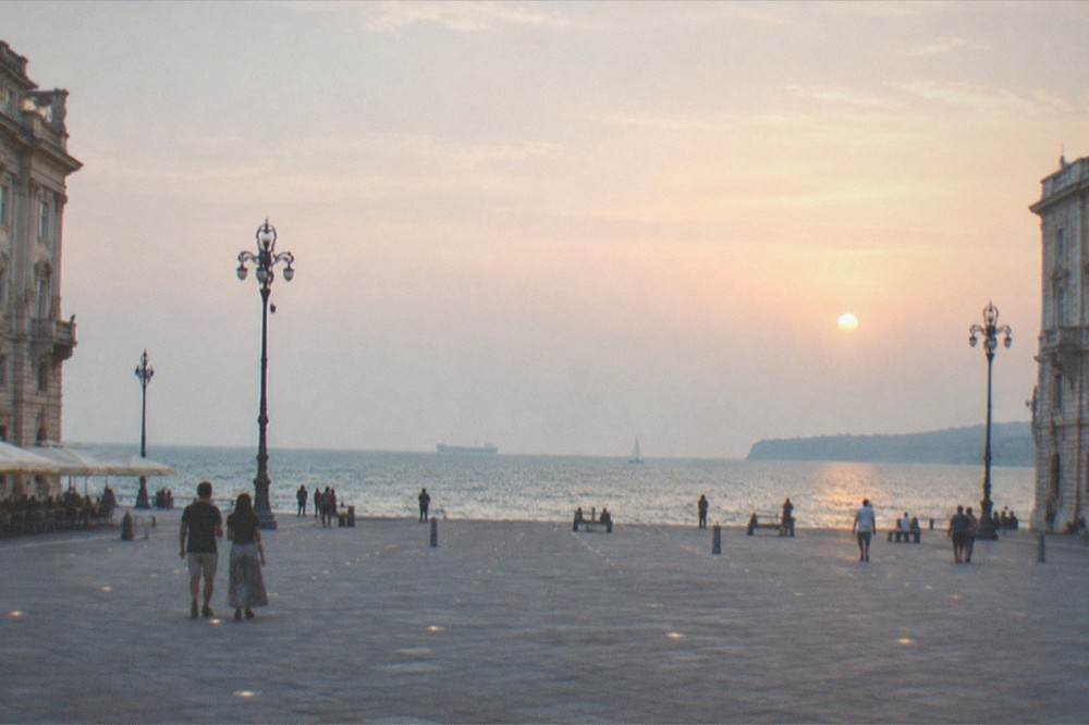 Piazza Unità d'Italia in Trieste at dusk with the square open to the sea