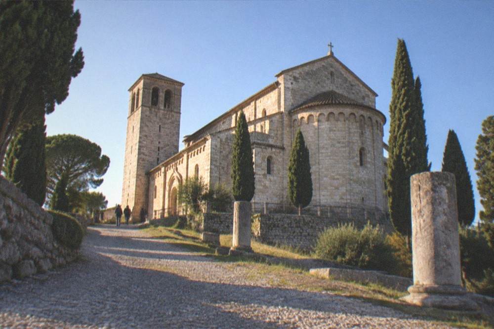 The San Giusto hill and cathedral of Trieste under a clear sky