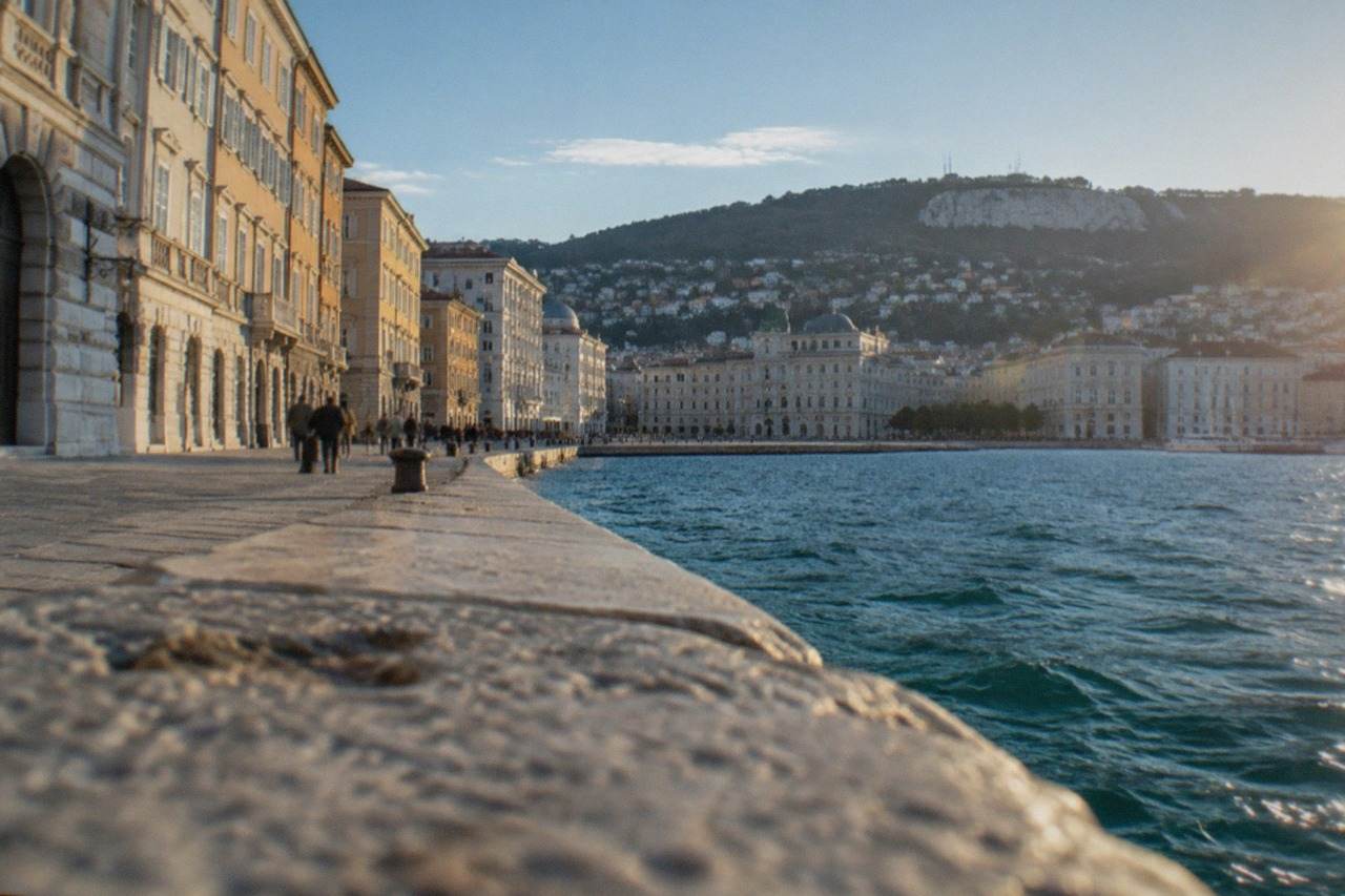 The seafront of Trieste with the Austrian-era buildings along the Rive and hills rising behind the gulf