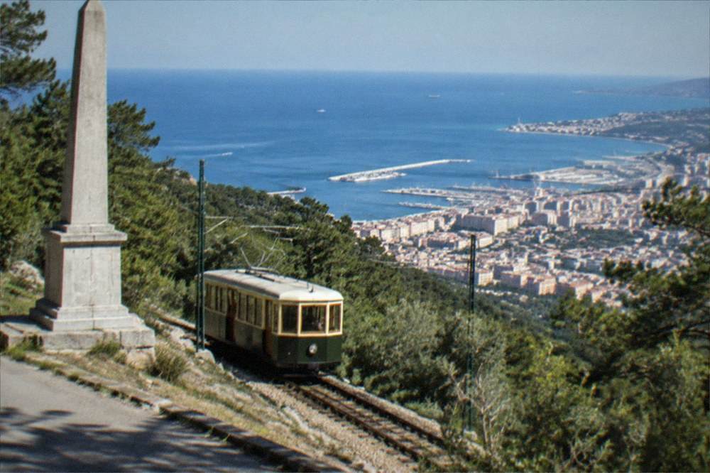 The historic Opicina tram climbing the hillside above Trieste with the gulf below