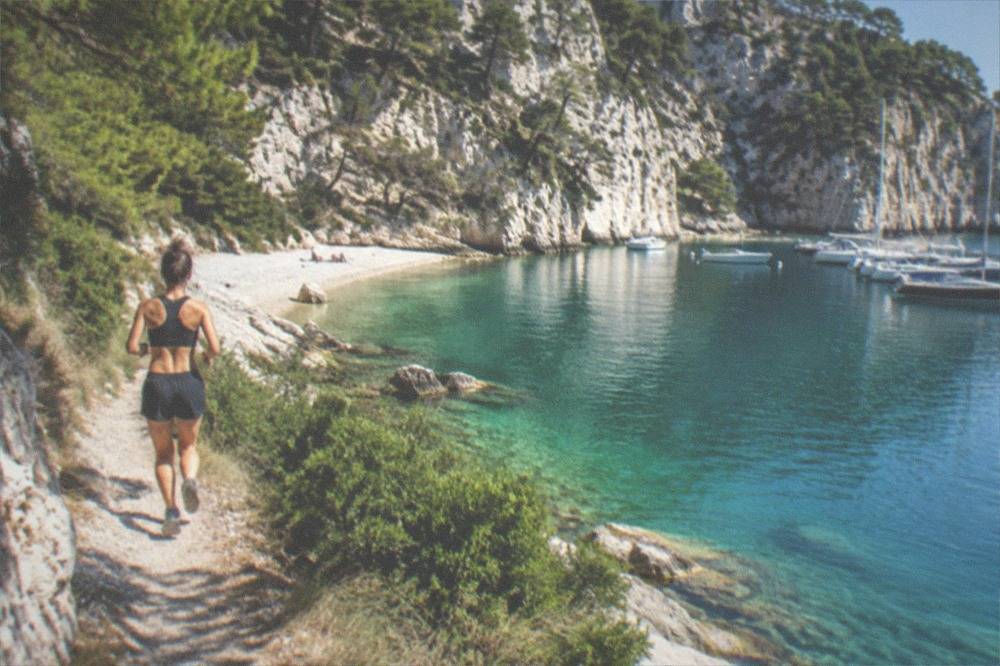 A rocky bay near Sistiana with clear turquoise water and pale cliffs above the beach