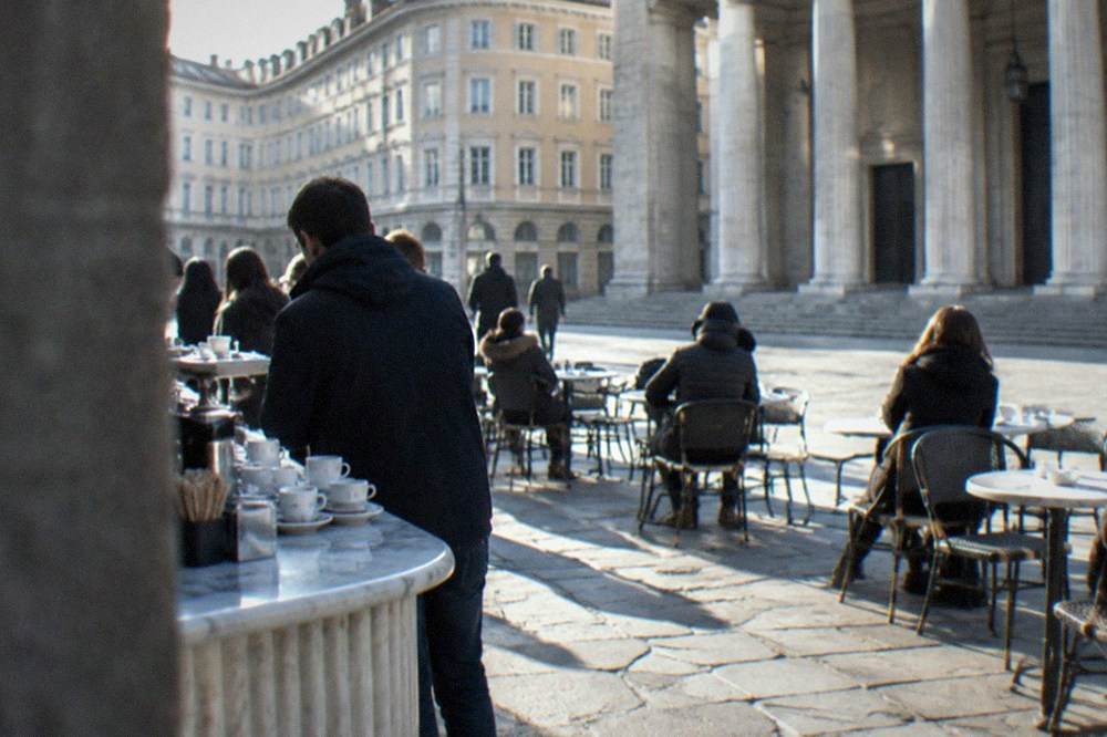A stand-up marble bar counter crowded with espresso cups during the morning rush