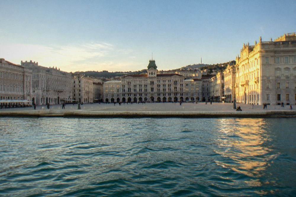 Piazza Unità d'Italia seen from the sea with the town hall facade and open square