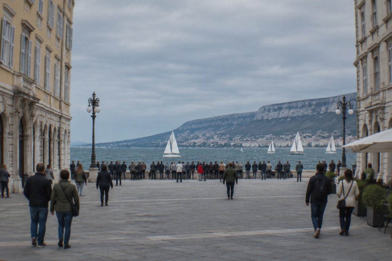 Crowds gathered along the Trieste seafront watching sailing boats out on the blue Gulf of Trieste