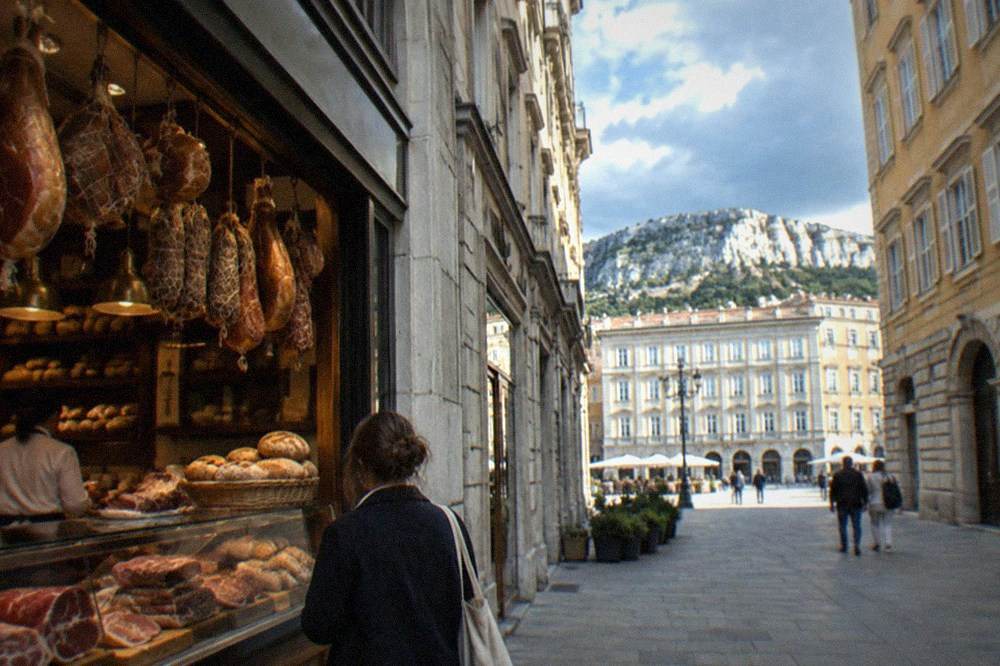 A Trieste buffet counter with cured meats and bread being served