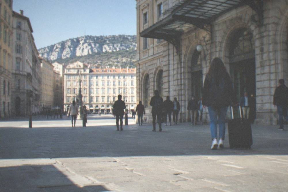 Passengers walking out of the front of Trieste Centrale railway station