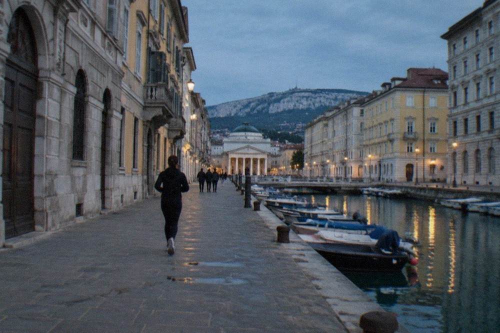 Neoclassical palazzi and a canal lined with historic buildings in Trieste
