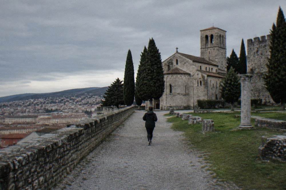 The medieval castle and cathedral on San Giusto hill above the rooftops of Trieste