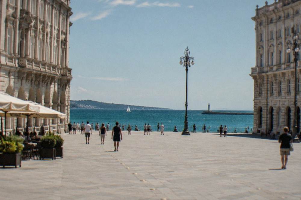 Piazza Unità d'Italia in Trieste, its ornate facades opening directly onto the seafront