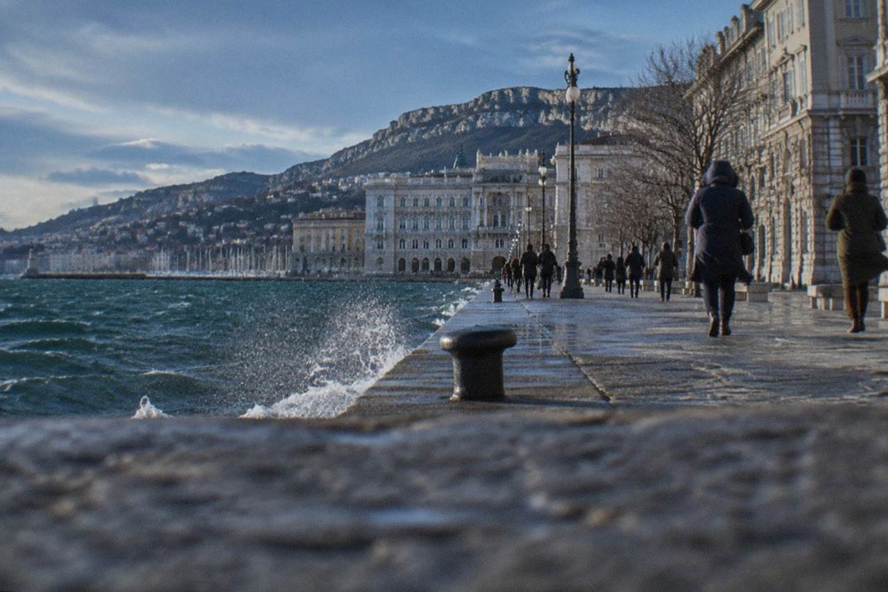 Trieste's seafront square lit on a short winter afternoon with the Adriatic behind it